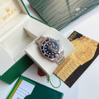 Rolex Submariner watch with black dial and stainless steel bracelet in display box