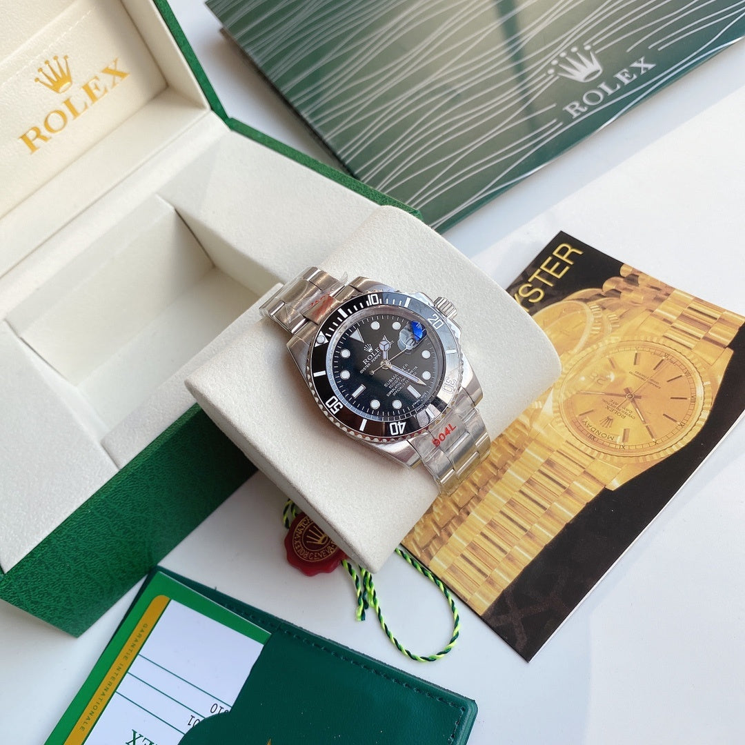 Rolex Submariner watch with black dial and stainless steel bracelet in display box