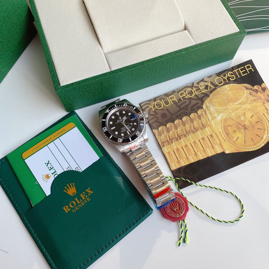 Rolex Submariner watch with black dial, date window, stainless steel bracelet