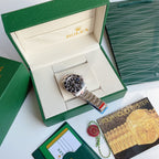Rolex Submariner watch with black dial, diver-style bezel, stainless steel bracelet
