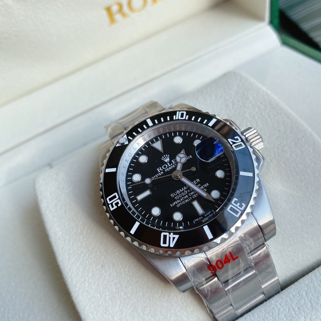 Rolex Submariner watch with black dial, blue-tinted accents, stainless steel bracelet