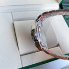 Rolex watch case side with crown and stainless steel bracelet, in presentation box
