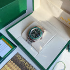 Green dial wristwatch with stainless steel bracelet and rotating bezel