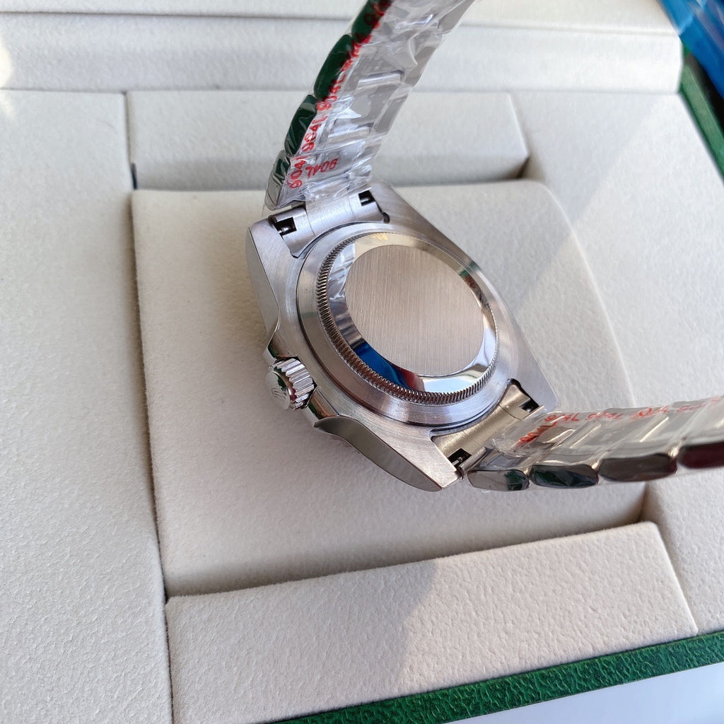 Stainless steel watch case side with crown and bezel detail