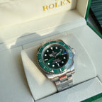 Green dial Rolex Oyster-style wristwatch with stainless steel bracelet and bezel