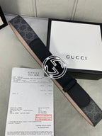 Black leather belt with GG monogram canvas and silver-toned interlocking buckle.