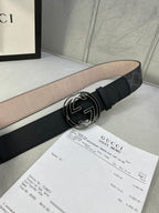 Black GG monogram belt with wide leather strap and silver interlocking logo buckle.