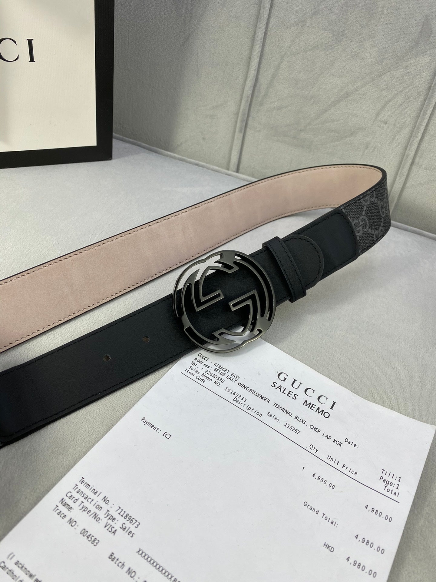 Black GG monogram belt with wide leather strap and silver interlocking logo buckle.