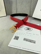 Red leather belt with gold CC-style buckle and adjustable hole strap