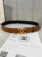 Brown leather belt with gold CC buckle and dark underside, with keeper holes