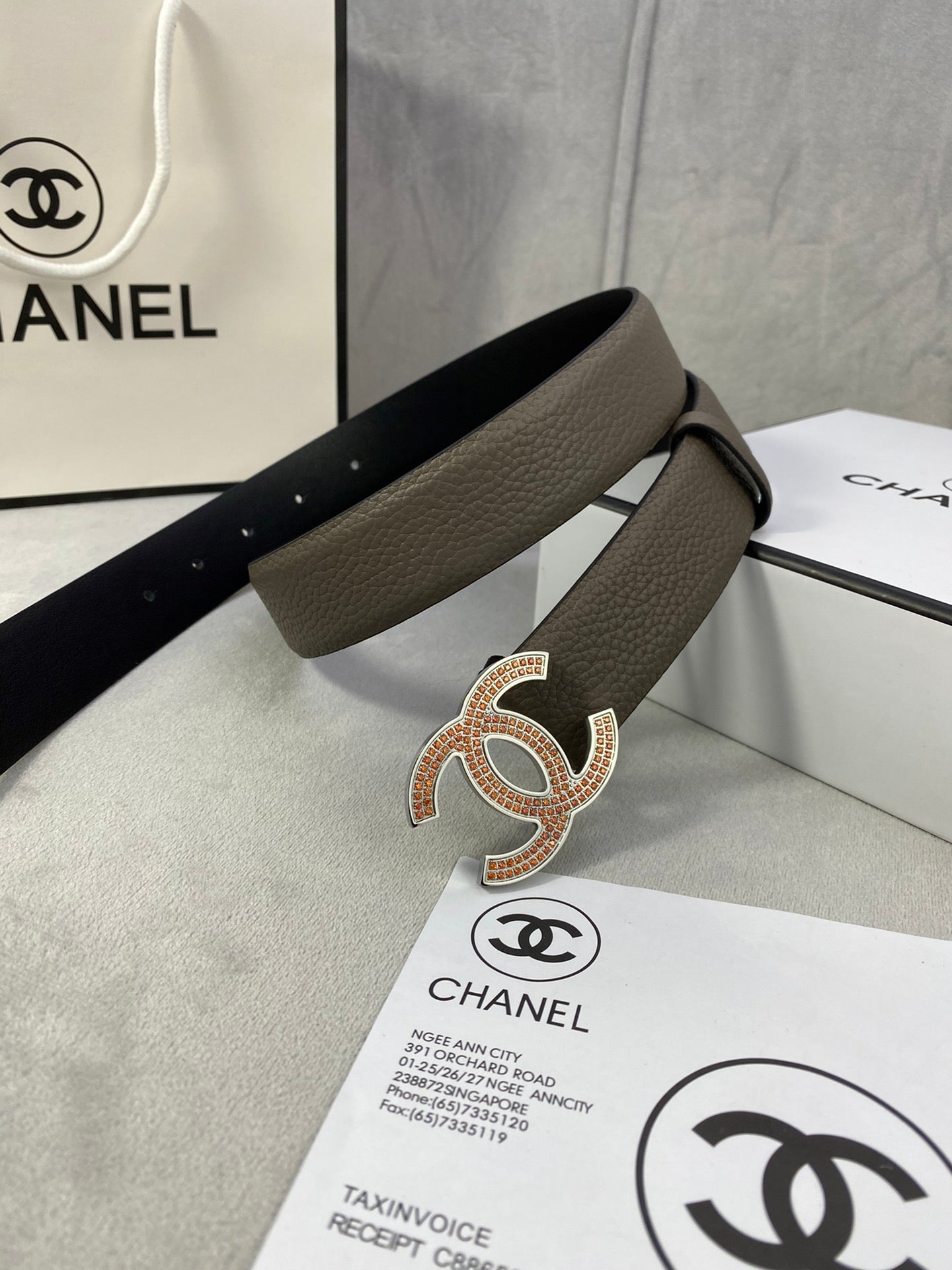 Chanel leather belt with gold rhinestone-style CC buckle, dark taupe strap