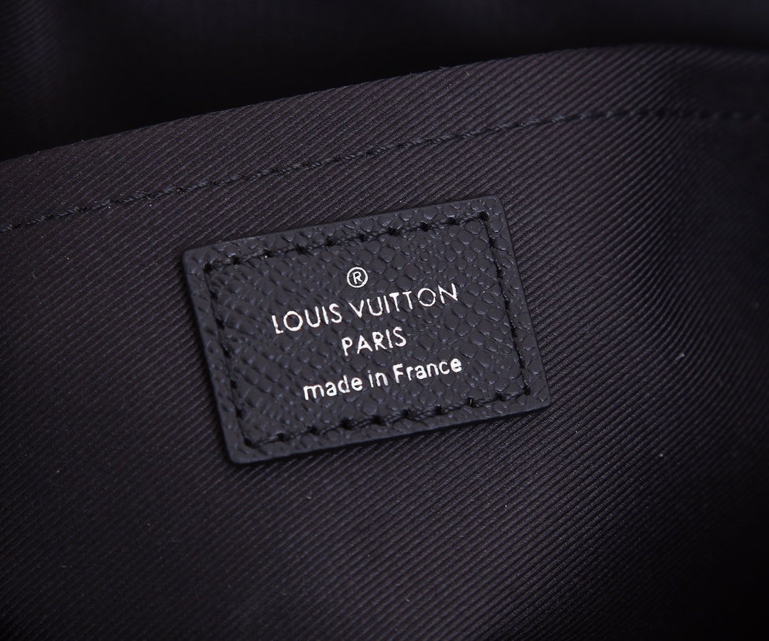 Louis Vuitton Paris made in France label on dark textured bag panel