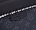 Louis Vuitton bag front tab label and silver zipper along textured dark fabric