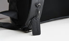Coah bag close-up of adjustable strap and front corner with zipper pull