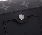 Louis Vuitton bag flap closure hardware with stitched leather panel on dark monogram
