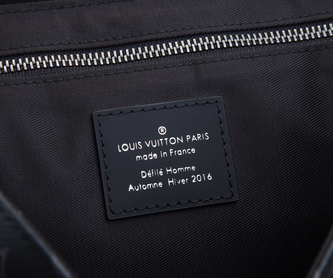 Louis Vuitton Paris tag on dark lining: made in France, stitched leather patch