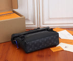 Louis Vuitton monogram bag with top handle, side accents, and black strap