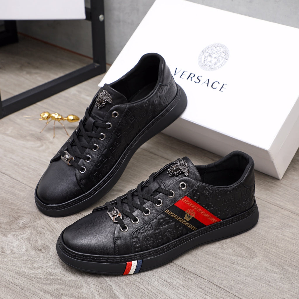 Black Versace lace-up sneakers with monogram texture and red-yellow side stripe