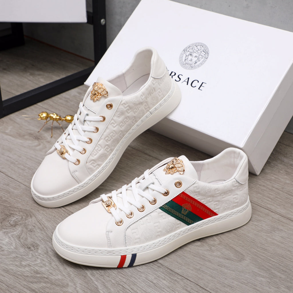 Pair of white Versace sneakers with gold-tone hardware, multicolor stripe and lace-up