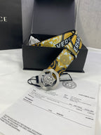 Versace belt with baroque blue-and-gold strap and gold Medusa buckle on black leather