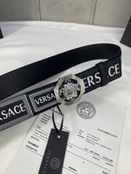 Versace belt in black with patterned strap and silver-toned medallion buckle, with tag