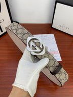 Gucci belt close-up: beige GG canvas with silver-tone double G buckle