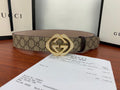 Gucci belt with beige GG canvas and gold-tone double G buckle, laid flat