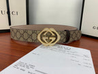 Gucci belt with beige GG canvas and gold-tone double G buckle, laid flat
