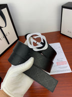 Gucci belt with dark jacquard strap and oversized silver-tone GG buckle