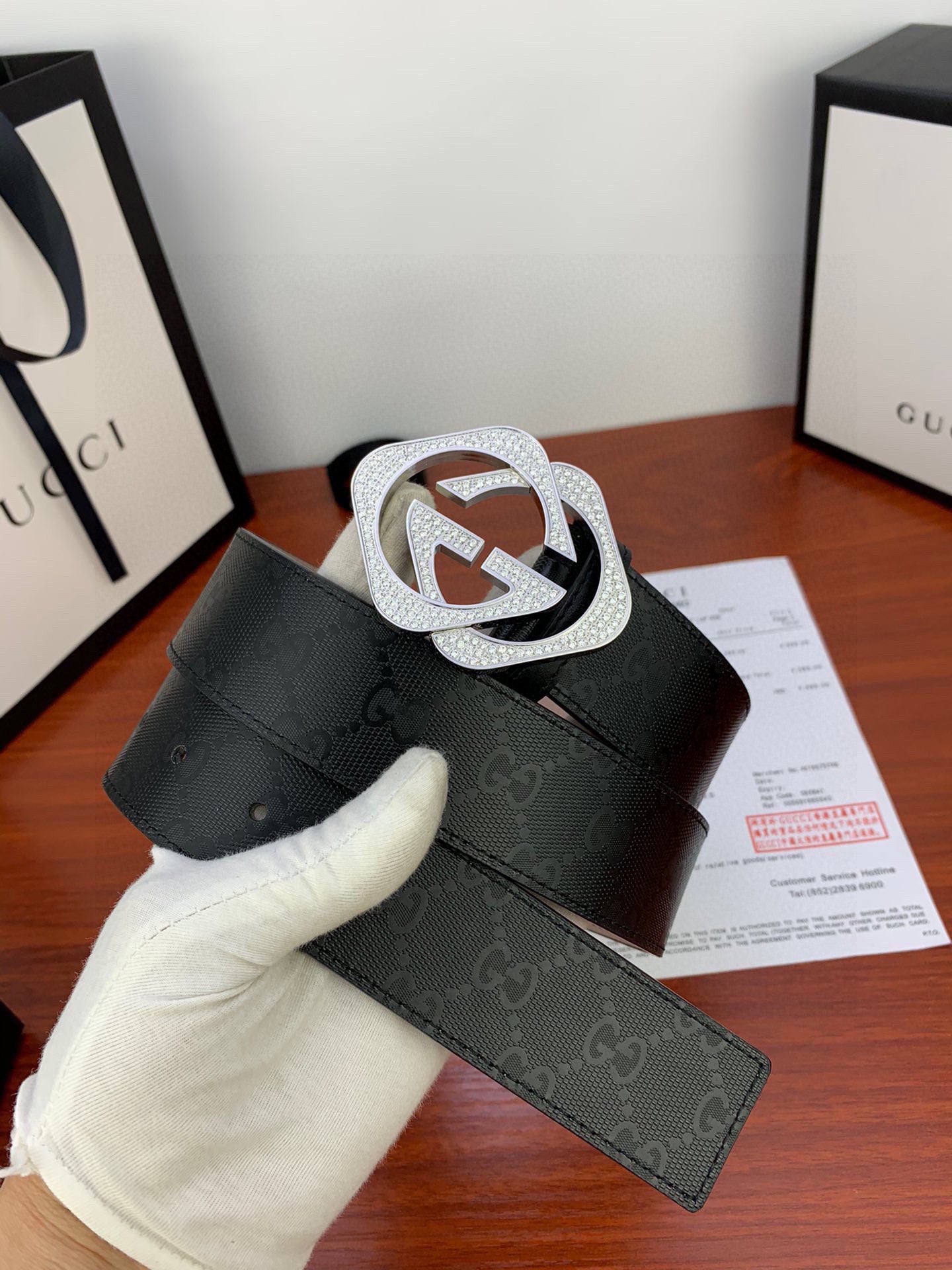 Gucci belt with dark jacquard strap and oversized silver-tone GG buckle