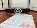 Gucci belt, black leather strap, GG logo buckle in silver and gold-tone
