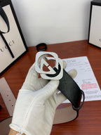 Gucci belt with black strap and large silver-tone GG buckle with sparkling trim