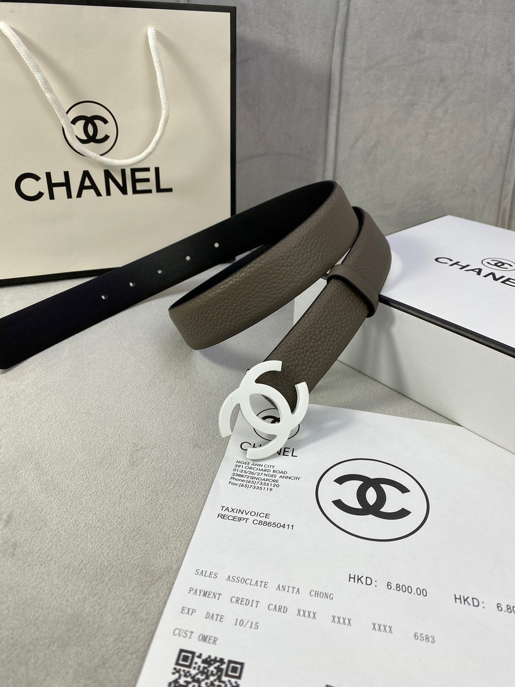 Dark olive leather belt with silver-tone interlocking CC buckle and textured finish