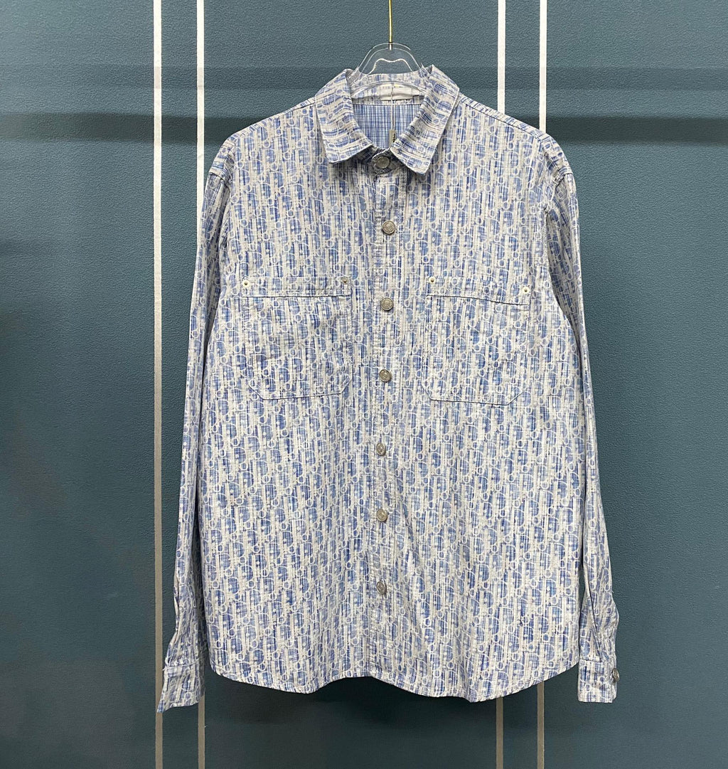 Blue and white patterned long-sleeve button-up shirt with pointed collar and buttons