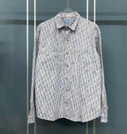 Blue and white patterned long-sleeve button-up shirt with pointed collar and buttons