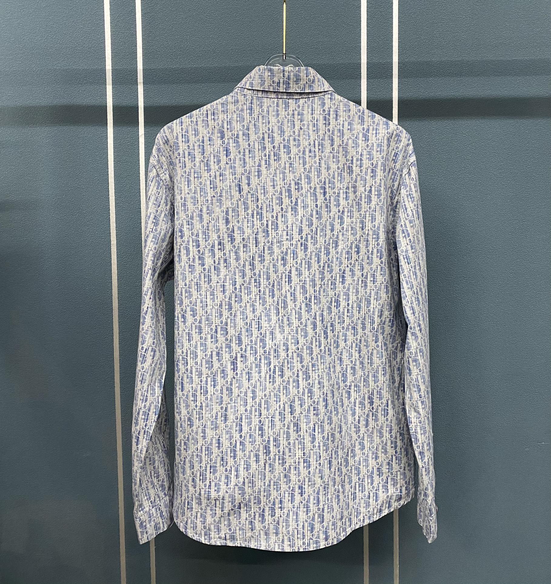 Blue and white patterned long-sleeve shirt back view with button placket