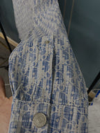 Blue and white patterned shirt close-up with vertical seam and round buttons