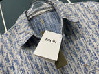 Blue and white patterned button-up shirt with DIOR tag and interior collar