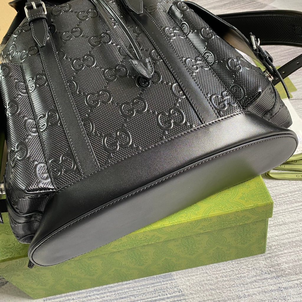 Black GG monogram shoulder bag with textured panels and smooth leather trim