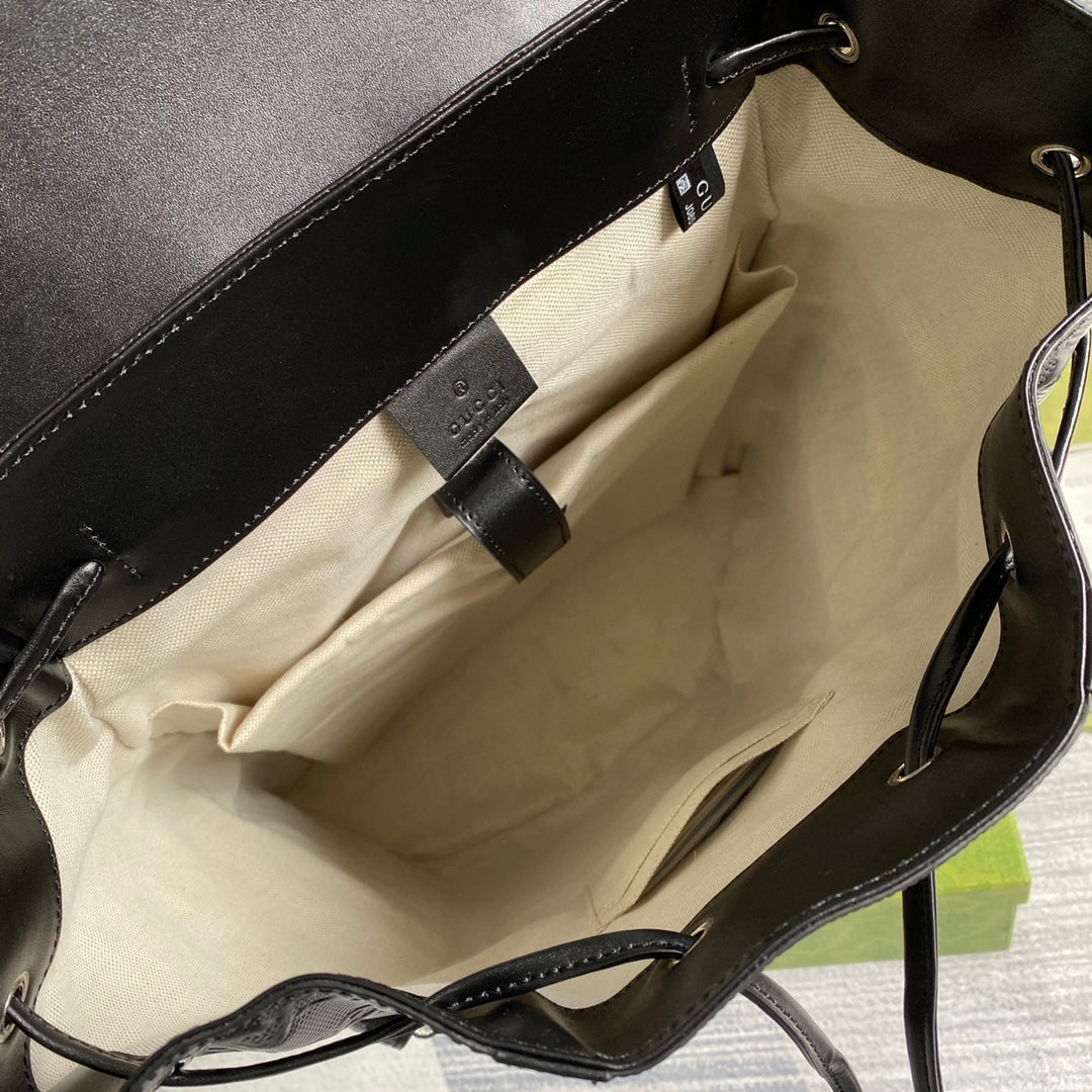 Black leather-lined bag interior with inner fabric and bottom panel
