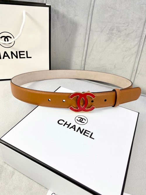 Brown leather Chanel belt with round holes and large red CC buckle