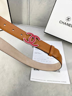 Close-up of brown Chanel belt strap with red CC buckle and hole lining
