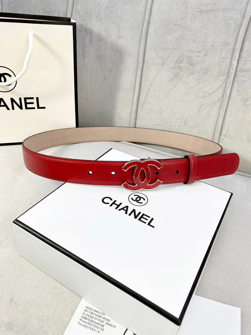 Red leather belt with Chanel CC logo buckle and gold-tone hardware, punched holes