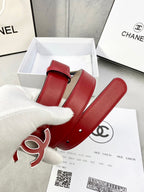 Red leather belt with Chanel CC logo buckle and gold-tone hardware, coiled in box