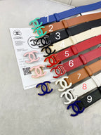 Assorted Chanel belts with colorful straps and logo buckles