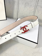 White Chanel belt with red logo buckle and wide tan keeper strap