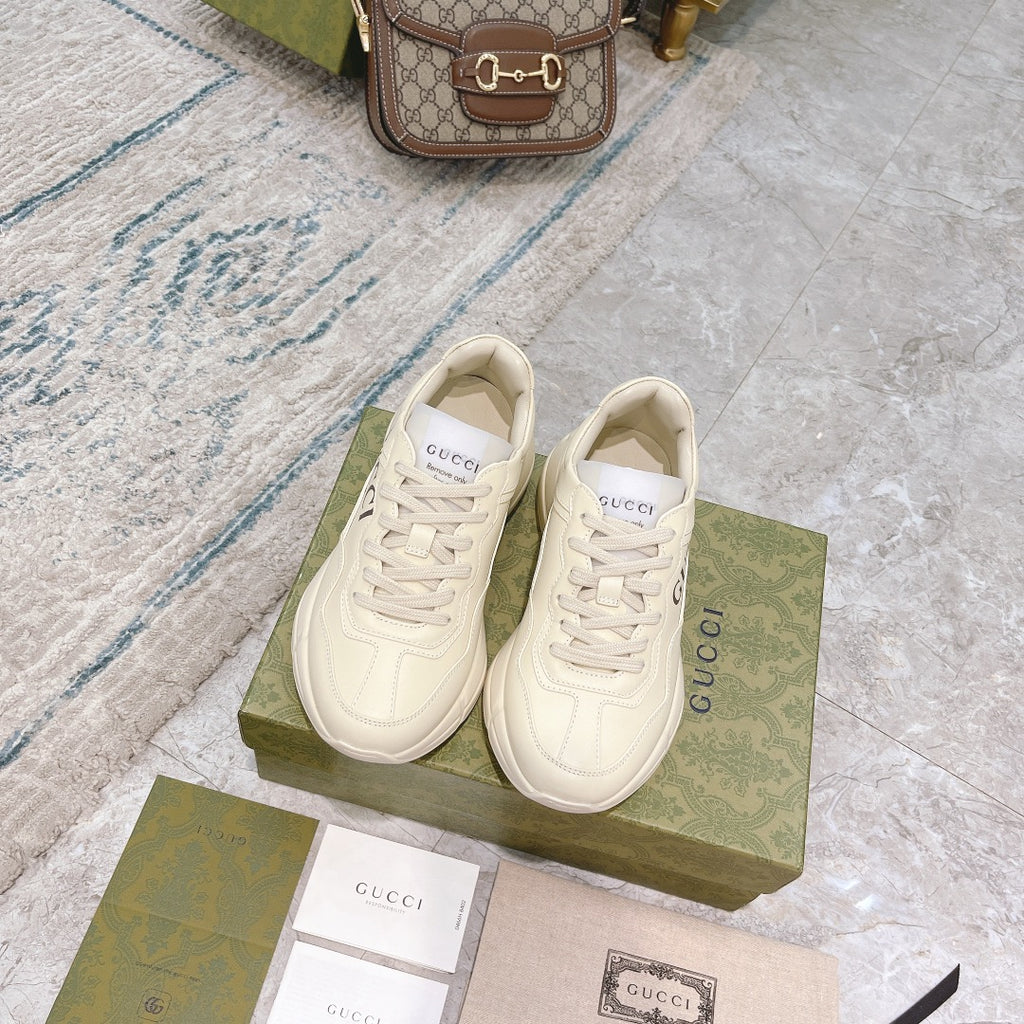 Gucci unisex sneakers pair in white with lace-up uppers and side branding
