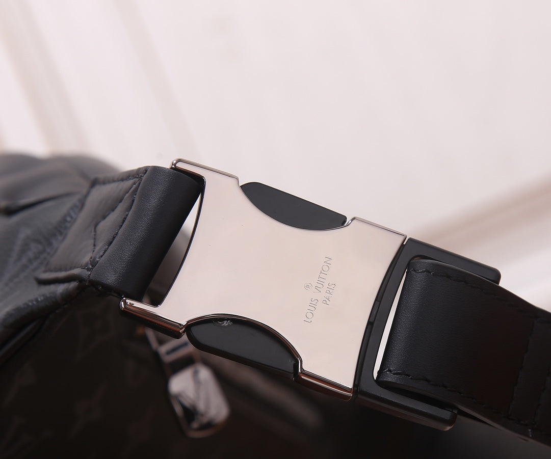 Louis Vuitton belt bag adjustable strap with metal buckle and black leather keeper