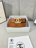 Tan leather belt with rhinestone CC buckle in a white gift box