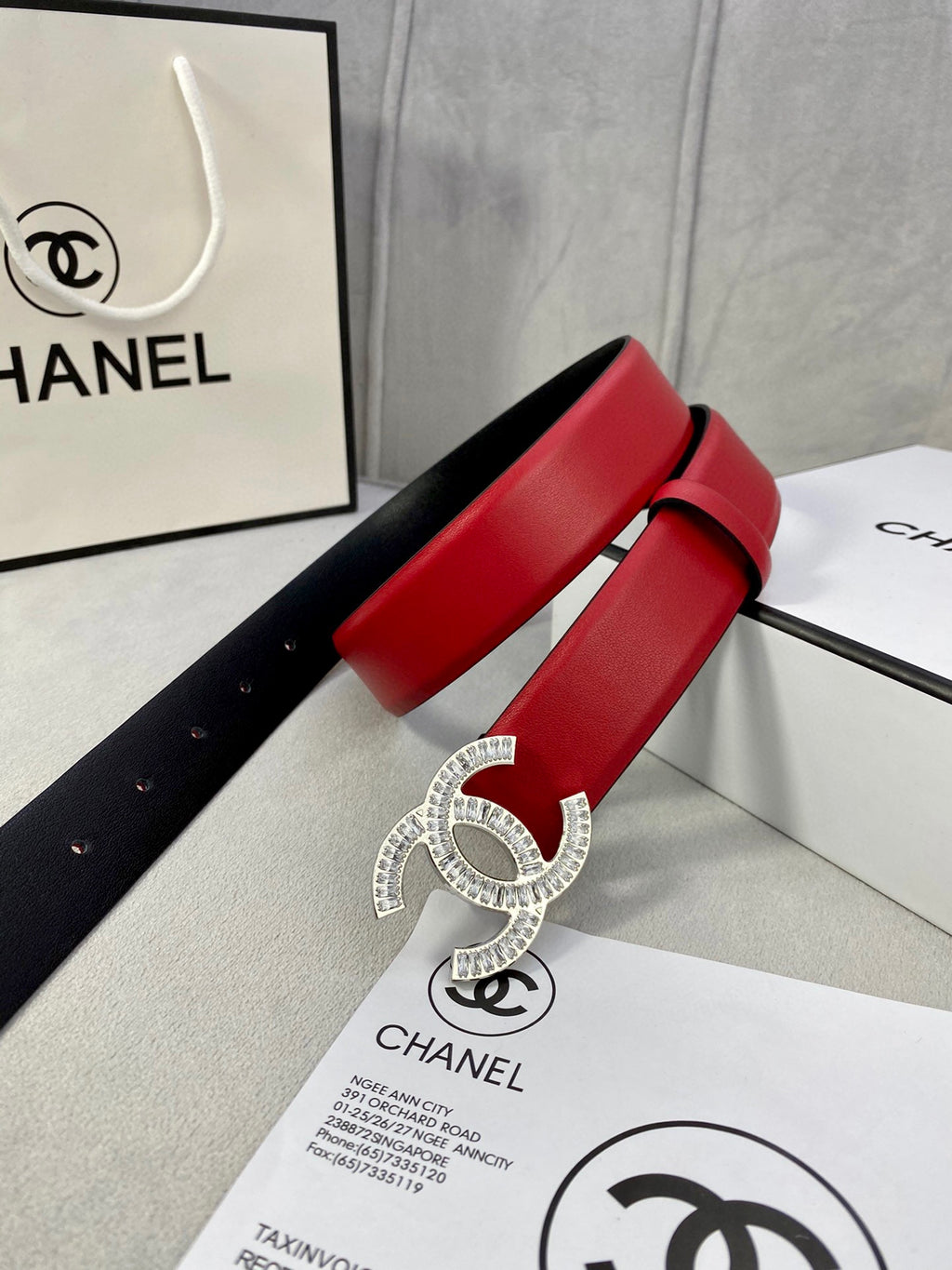Red leather belt with large Chanel gold-tone double C buckle detail